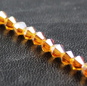Chinese 4mm Bicone Crystals - Topaz AB